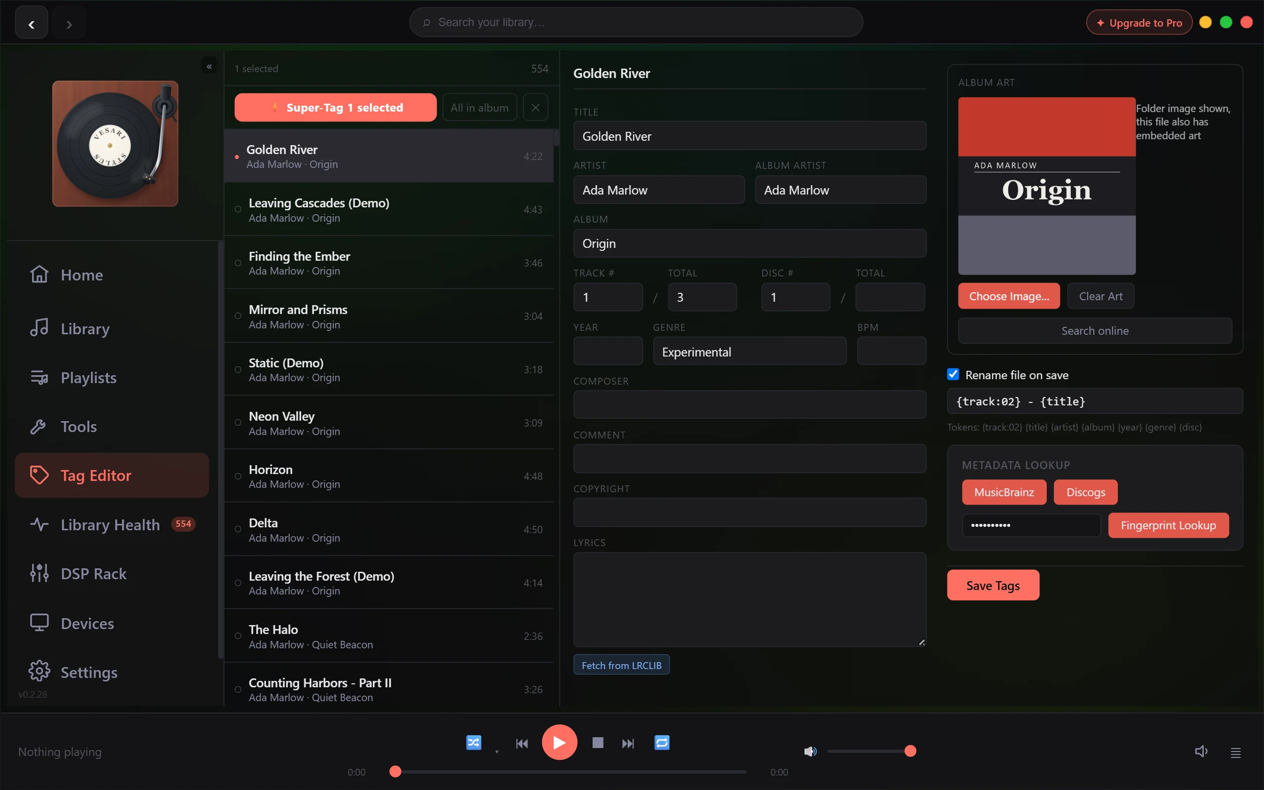 The Tag Editor showing a selected track with its editable title, artist, album and year fields, and the album artwork panel beside them.